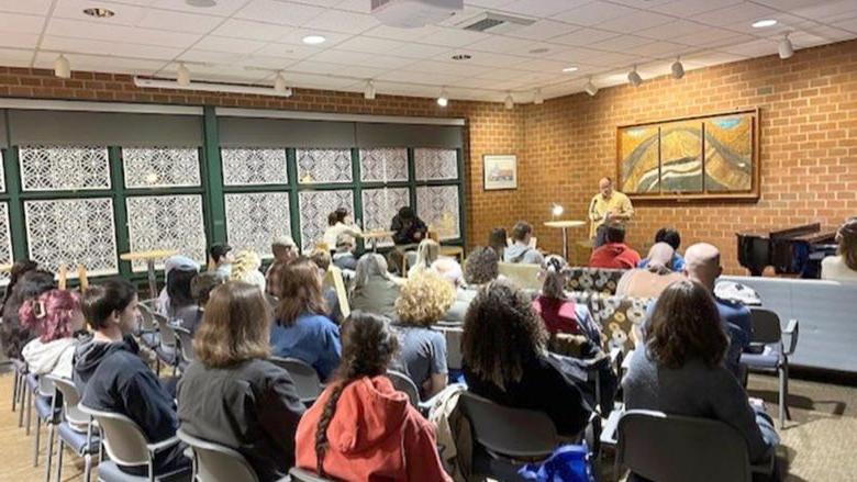 Professor Todd Davis reads from his work at the fall 2024 Hard Freight Café